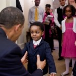  President Barack Obama greets a young visitor in the Oval Office, February 5, 2010. (Official White House Photo by Pete Souza).