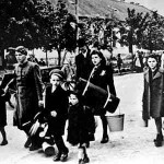 Jewish people arrive at the concentration camp and ghetto in Terezin. Their last belongings would soon be taken by the Nazis.