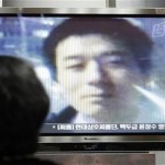 People watch story about Robert Park on South Korean television. 